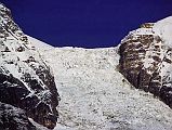 409 Dhaulagiri Icefall Close Up Early Morning From Lete �The East glacier's a great torrent of ice.� R�buffat explained. �Even supposing we did succeed in getting up the glacier,� continued Lachenal, �I don't quite see how we should get on to the north ridge. My own view is that we shouldn't try. It's a regular Walker (The north buttress of the Pointe Walker on the Grandes Jorasses is perhaps the most difficult climb in the Alps) with seracs stuck on!�  ... These mountains are unclimbable! No expedition could ever get through this way [Dhaulagiri Icefall]�� (Maurice Herzog, Annapurna). Here is a close up view of the Dhaulagiri East Glacier from Lete.